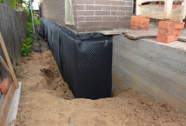 Happy homeowners after waterproofing job in Mountain